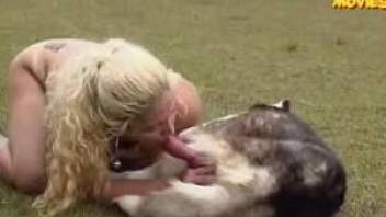 Naked blonde chills outdoors with big shaggy doggy