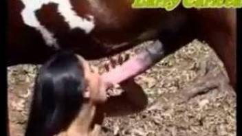 Nude babe loads her creamy cunt with a giant horse cock