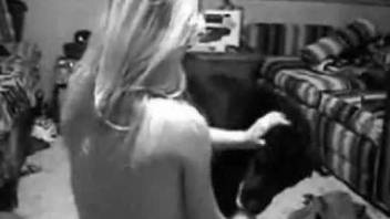 B&W bestiality video with a hot teen and a horny dog
