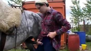 Short hair hottie worships an oversized horse cock