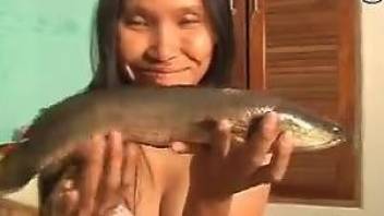 Asian babe is os happy to shove eel inside pussy
